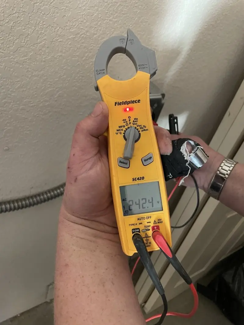 Voltage testing with clamp meter during Whole House Surge Protector in Bayonne